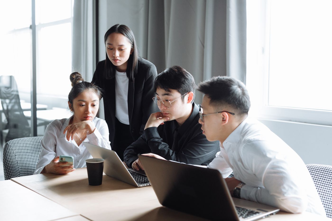 Illustrative stock photograph of colleagues reviewing work together